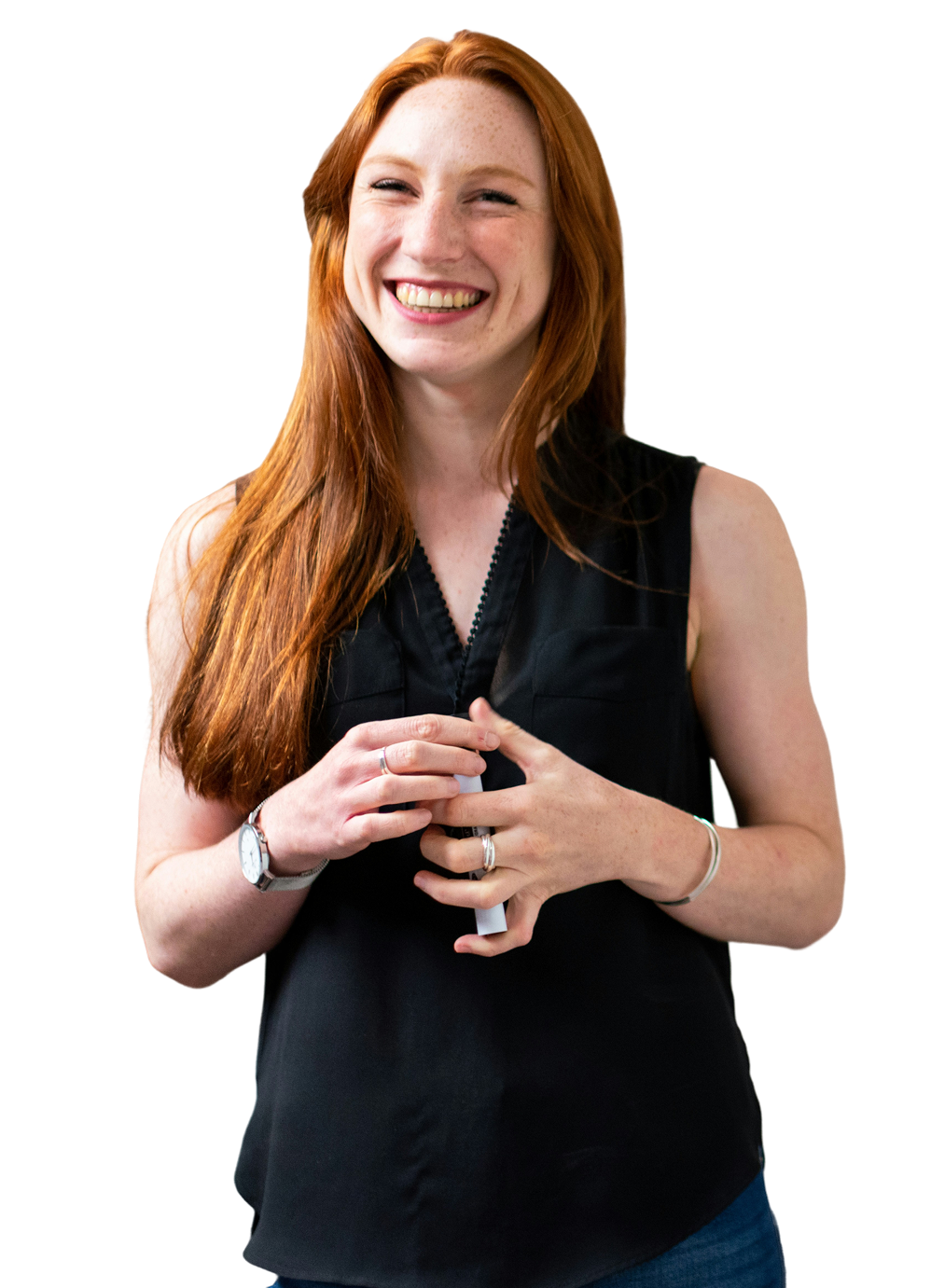 A smiling woman with long red hair, wearing a black top